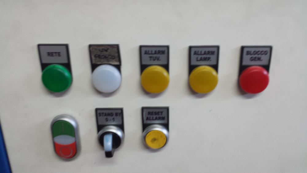 Push-buttons, indicator lights and selector on an electromechanical control console